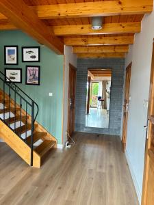 a living room with a staircase and a brick wall at Żuławska Osada in Trutnowy +37 photos