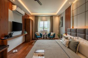 a living room with a couch and a table at Perfectstayz AIIMS near Aiims Hospital in Rishīkesh