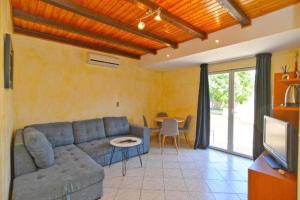 a living room with a couch and a table at Apartman Mara in Pomer