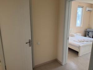 a small bedroom with a bed and a window at LizAna in Shekhvetili