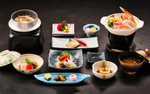 a group of plates of food on a table at Nunohiki Onsen Komoro in Komoro