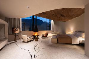 a bedroom with a large bed and a large window at Enjoy nature Be energetic in Yunji +137 photos