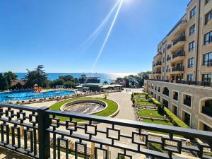 a view from a balcony of a building and a pool at Europroperties Zlatna Kotva Apartments in Golden Sands
