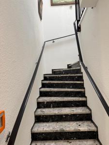 a staircase in a building with a stair case at Gästehaus am Binnensee in Heiligenhafen