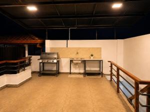 a kitchen with a stove and a sink in a room at Crescent Villa in Kalutara +10 photos