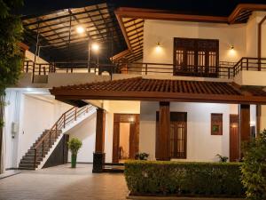 a building with a staircase in front of it at Crescent Villa in Kalutara