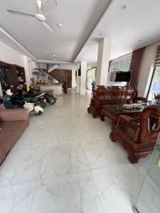 a living room with a person laying on the floor at LD Housing 9 in Ðống Thôn