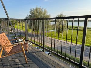 a swing on a balcony with a view of a road at Tamula Panorama in Võru