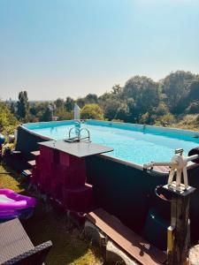 a large swimming pool with a table next to it at Tippelsberg in Bochum