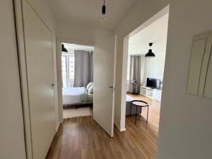 an open door to a bedroom with a bed at Green & Quiet Apartment in Haapsalu in Haapsalu