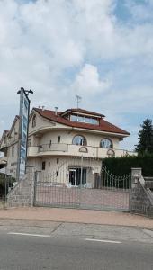 a building with a fence in front of it at La Capinera Sabry's Home in Vezza d'Alba