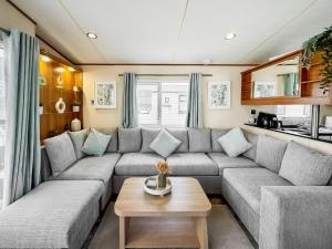 a living room with a couch and a table at Abi St David - Ukc9615 in Rowen