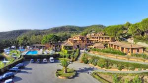 an aerial view of a house with a parking lot at Essence Isola d'Elba - Le Picchiaie Resort in Portoferraio