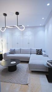 a living room with a couch and a table at chez-moi sfax in Sfax
