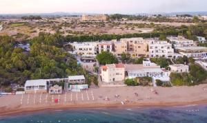 an aerial view of a beach with buildings at Bahari Beachfront Aparthotel Selinunte in Marinella di Selinunte