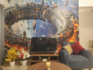 a living room with a mural of a roller coaster at 2BHK Luxurious Apt near BKC in Mumbai