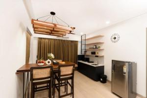 a kitchen and dining room with a table and chairs at Calangute Heights in Calangute
