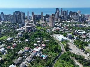 an aerial view of a city with tall buildings at Seaside Cottages, BEDO HOUSE in Batumi