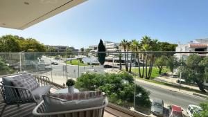 a balcony with a view of a city street at Prime - Shared Pool - 6 Guests - Albufeira in Albufeira