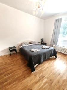 a bedroom with a bed and a wooden floor at Reipas Ekonom Accommodation in Kotka +3 photos
