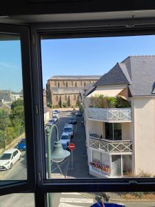 a view of a street from a window at Joli Duplex Centre-ville 5km Dinard in Pleurtuit