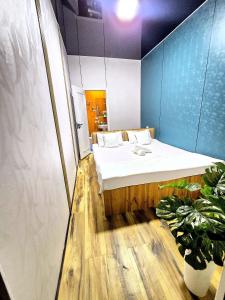 a bedroom with a bed in a room at HALAL apartments in Tashkent city, Metro in Aktepa-Chigatay