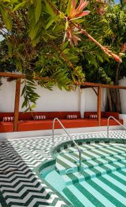 a swimming pool with a green and white floor at BV House - Membersclub - Adult only in Estepona