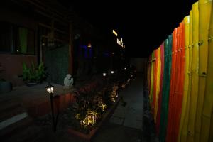 a row of lights on the side of a building at Roots in Pune +11 photos