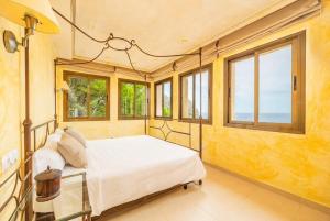 a bedroom with a bed in a room with windows at Port Andratx - 3444-29 Mallorca in Port d'Andratx +40 photos