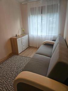a living room with a couch and a window at Laeva in Pärnu