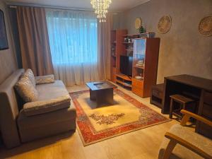 a living room with a couch and a coffee table at Laeva in Pärnu
