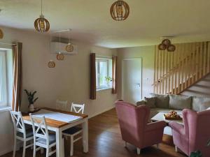 a living room with a table and a couch at Apartmán Zulu in Liptovský Mikuláš