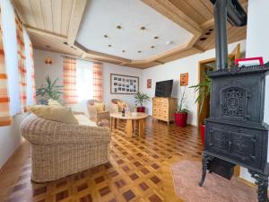 a living room with a fireplace and a stove at Ferienwohnung Binder - Ferienwohnung Bad Windsheim in Bad Windsheim