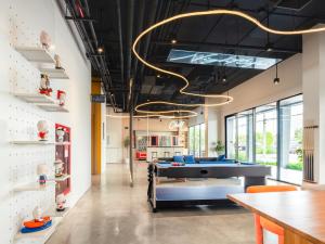 an office with a pool table in the middle of a room at Bedz Hotel Ban Bueng in Ban Bung