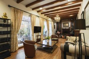 a living room with a couch and a table at Hotel MR Les Rotes in Denia