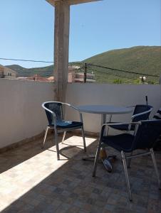 a table and chairs on a patio with a view at Latina lastva in Budva