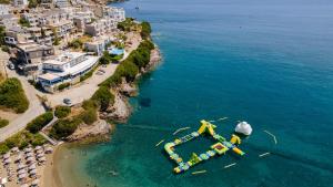 an aerial view of a water slide in the ocean at Galini Apartments in Bali