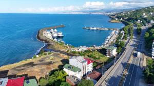 an aerial view of a harbor with a marina at Akçakale Konaklama in Akcaabat