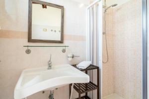 a bathroom with a white sink and a shower at Dimora La Vignazza in Marzamemi +31 photos
