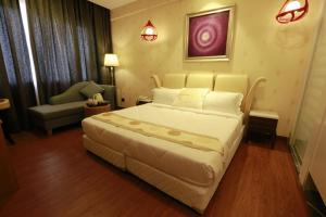 Letto o letti in una camera di Pal Heights Mantra
