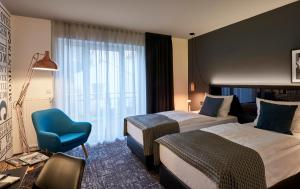 Postel nebo postele na pokoji v ubytování Dom Hotel + 37 fotografií