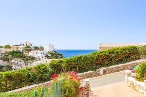 a view of the ocean from a house at Villa Olga in Cala en Porter