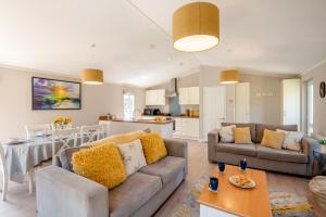 a living room with a couch and a table at 3 Bed in York oc-90401 in Riccall