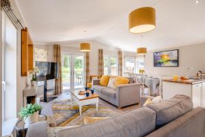 a living room with a couch and a table at 3 Bed in York oc-90401 in Riccall