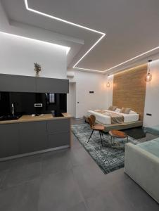 a living room with a bed and a kitchen at Luxury Marina apartments in Rijeka