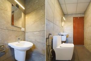 a bathroom with a toilet and a sink at Collection O Kottayam Railway Station in Kottayam