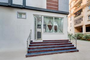 a set of stairs in front of a building at Super Townhouse Telapur Junction Formerly Fortune Inn in Hyderabad