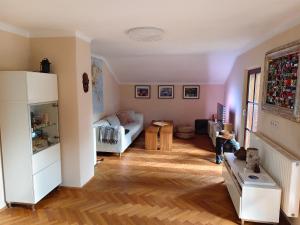 a living room with a couch and a table at By Wallner's in Sankt Leonhard +1 photo