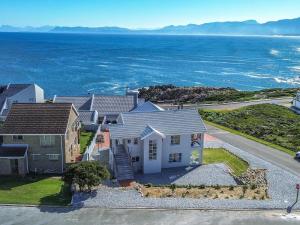 an aerial view of a house with the ocean at Bluemist Accommodation in Gansbaai