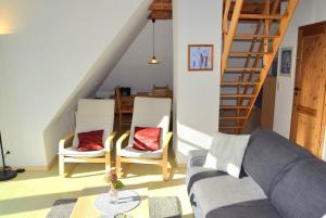 a living room with a couch and two chairs at Zaumseil, Axel Fe-App "oben" in Schönberg